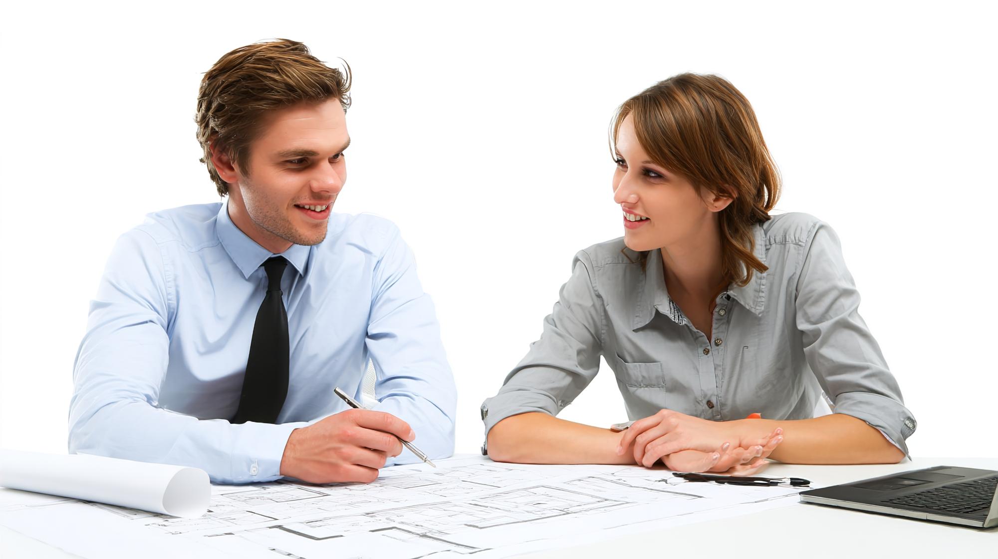 Consultant meeting client at a desk
